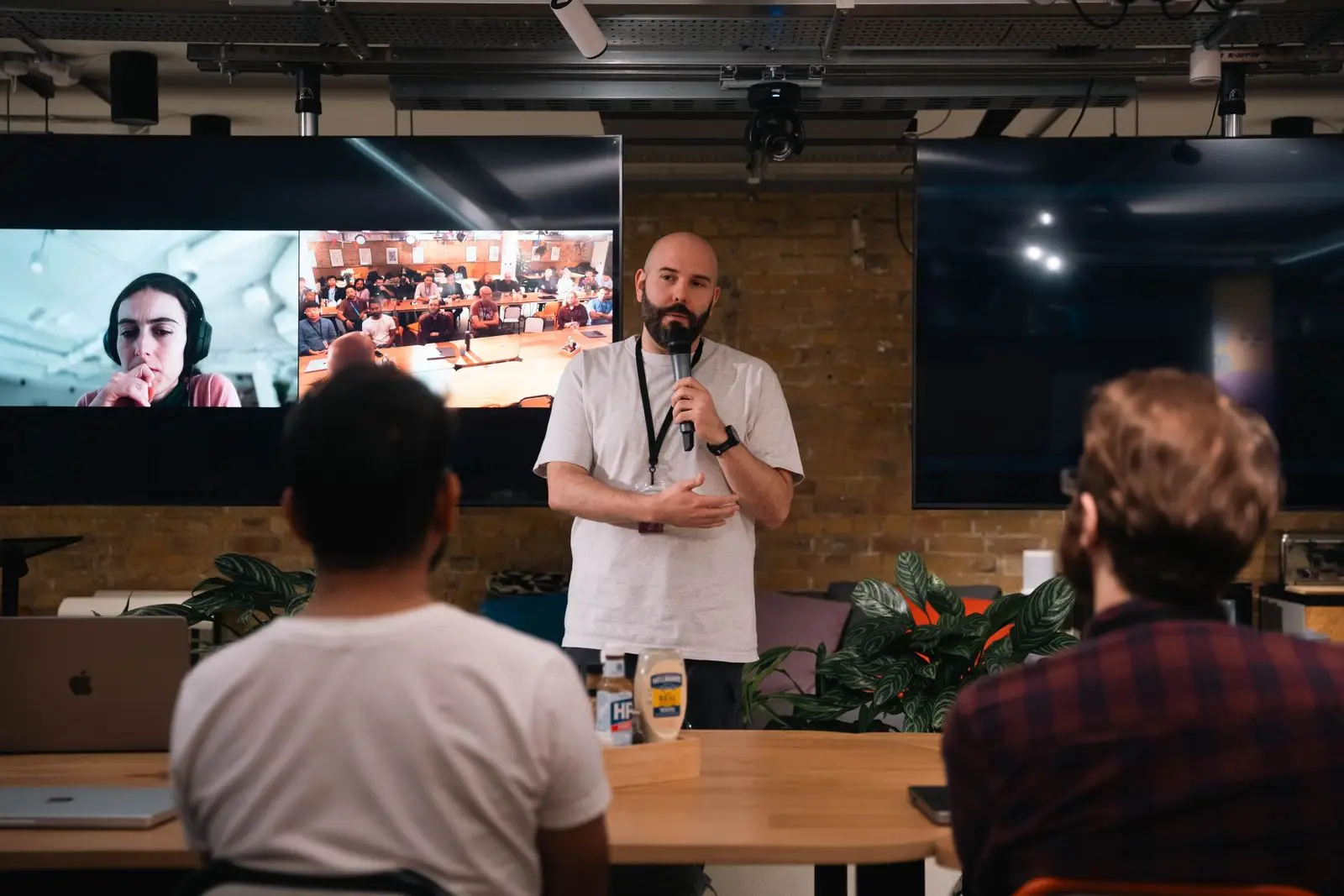 Speaker presenting at a tech conference