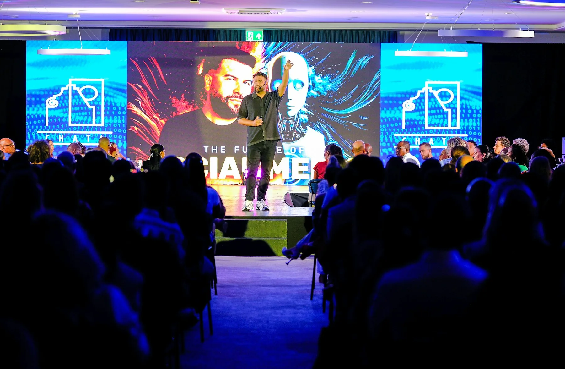 Conference speaker presenting to an engaged audience at an industry event